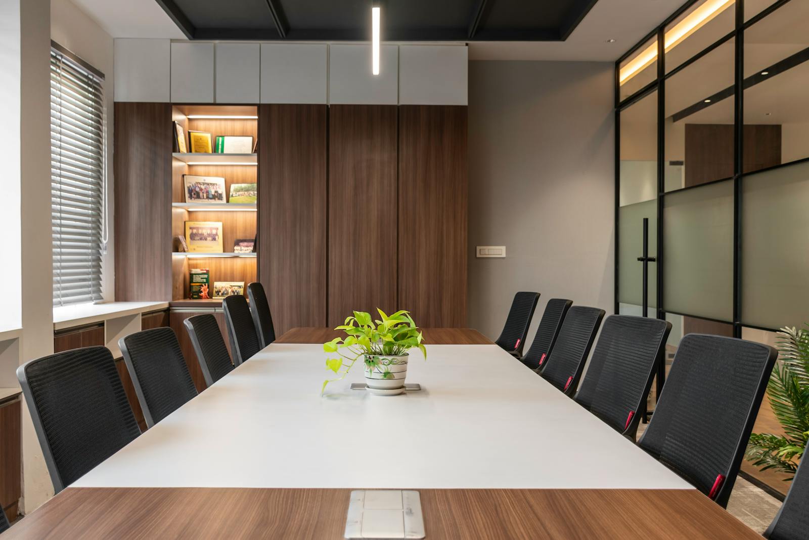 Modern fitted office interior showing installed furniture, storage, and meeting setup